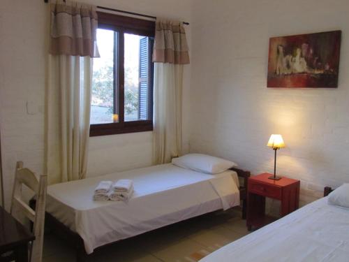 Ένα ή περισσότερα κρεβάτια σε δωμάτιο στο Pousada La Vivienda