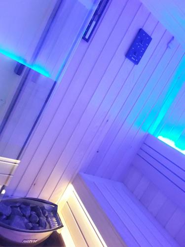 a room with a bowl of rocks on a table at SPA APARTMAN "SaUna" in Prijedor