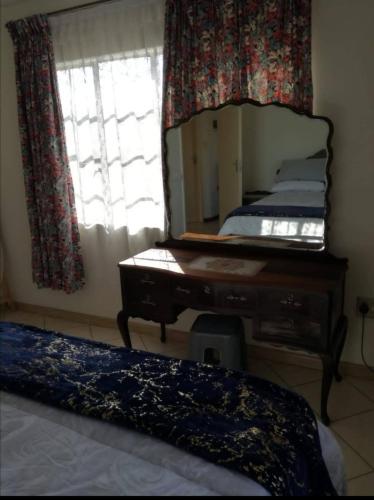 Ένα ή περισσότερα κρεβάτια σε δωμάτιο στο VSA Self-catering accommodation