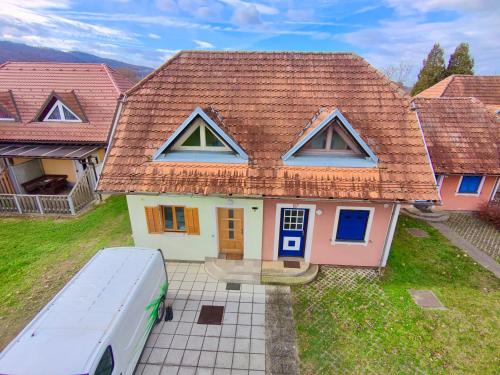 a white van parked in front of a house at Villa Petz in Brežice