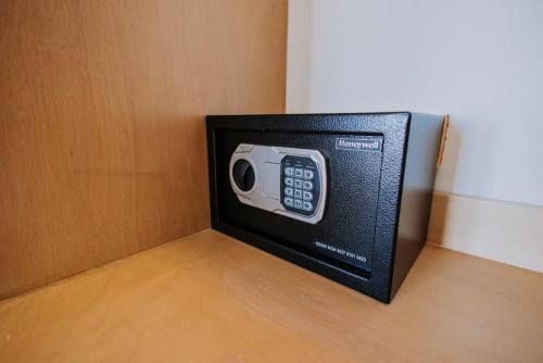 a small tv sitting on top of a wooden floor at 605 Tower Downtown Cabo in Cabo San Lucas