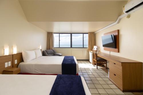 Una cama o camas en una habitación de Hotel Dan Inn Mar Piedade - Grande Recife By Nacional Inn