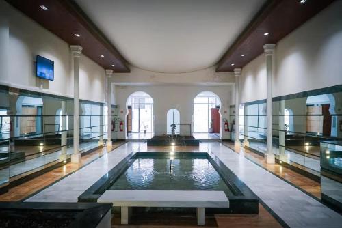 a large room with a pool of water in a building at LUXURY DOWNTOWN BEACH Apartment 2 Bedroom in Tangier