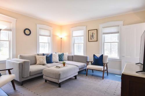 a living room with a couch and a chair at Private Downtown Wellfleet Location in Wellfleet