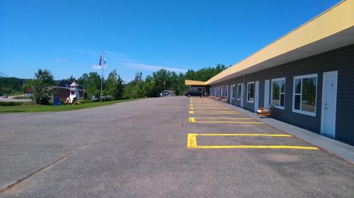 an empty parking lot next to a building at Oasis Motel in Antigonish