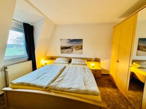 En eller flere senge i et værelse på Apartmenthaus-Usedom Kajüte 10