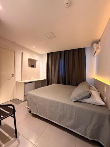 Ένα ή περισσότερα κρεβάτια σε δωμάτιο στο Hotel Mais Lazer