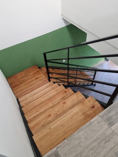 En eller flere senge i et værelse på Mirasoles Suites