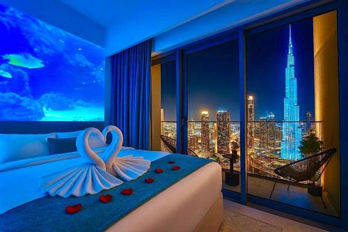En eller flere senge i et værelse på Burj Khalifa View - Immersive Expérience - Downtown - DUBAI 3BR