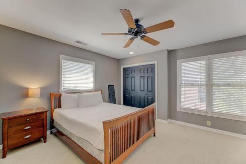 a bedroom with a bed and a ceiling fan at The Landing at Wheat St. 2Br in Columbia