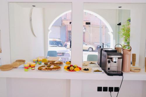 a table with food on a counter with a printer at فندق منسي Monsi Hotel in Taif