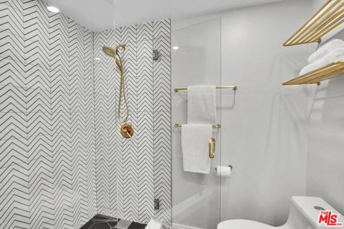 a bathroom with a shower and a toilet in it at Echo Lake view condo - newly renovated - centrally located in Los Angeles
