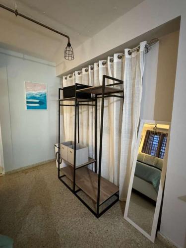 a loft bed in a room with a window at The Spot at Rincon in Rincon