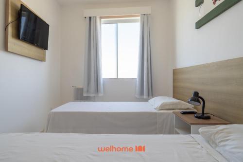 Et tv og/eller underholdning på Apartamento no Centro de Macae a Metros da Praia