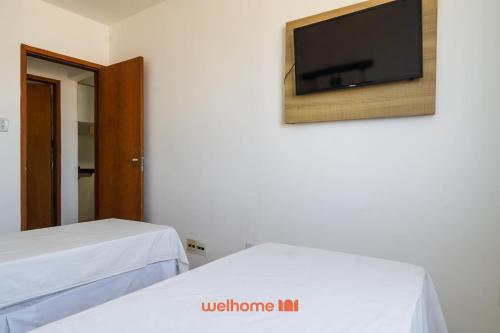 En eller flere senge i et værelse på Apartamento no Centro de Macae a Metros da Praia