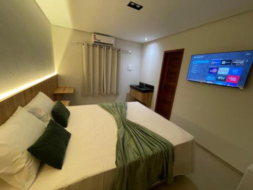 Pousada Na Serra Ubajaraにあるベッド