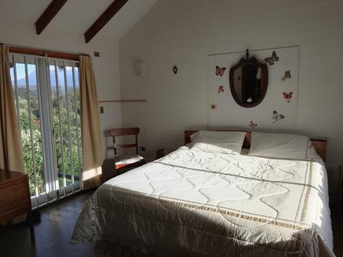 En eller flere senge i et værelse på Casa en parcela