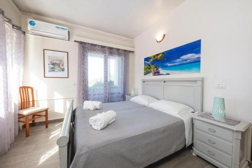 En eller flere senge i et værelse på Villa Maganuco Park - Pool, Sea and Garden