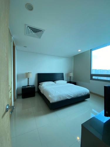 En eller flere senge i et værelse på Blue Gardens