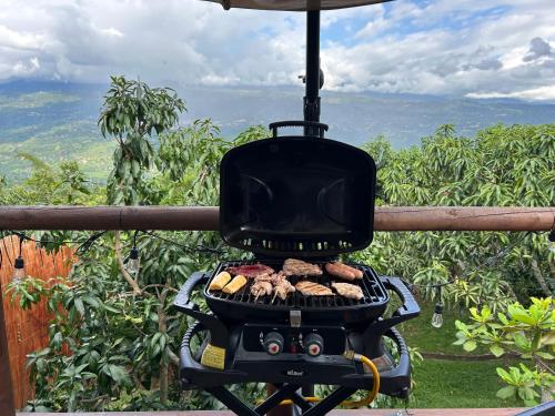 a grill with a bunch of cookies on it at Glamping Entre Mangos in La Mesa
