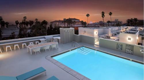 an image of the rooftop of a hotel with a swimming pool at Ocean Views - Rooftop Pool 2BR Santa Monica in Los Angeles