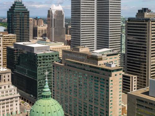 a group of tall buildings in a city at Fairmont The Queen Elizabeth in Montréal