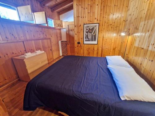 En eller flere senge i et værelse på Coccola Zoldana - Lovely apartment 2BR