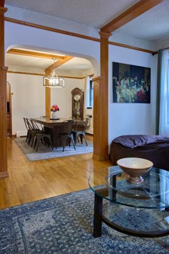 a living room with a couch and a table at Sweet Home - Zoller Stays in Long Island City