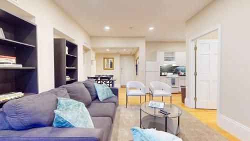 a living room with a couch and a table at 2 Bedroom Unit in the Heart of Back Bay in Boston