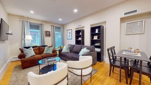 a living room with a couch and a table at 2 Bedroom Unit in the Heart of Back Bay in Boston