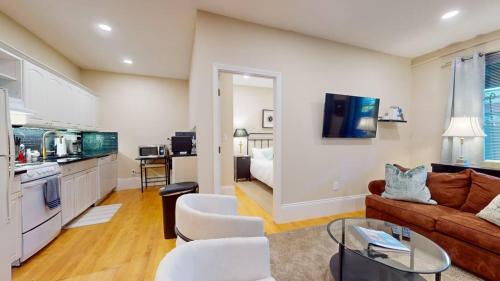 a living room with a couch and a table at 2 Bedroom Unit in the Heart of Back Bay in Boston