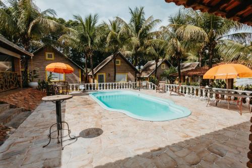 Swimmingpoolen hos eller tæt på Pousada Chalés Jardim das Aguas