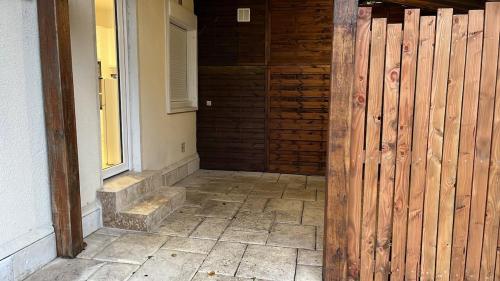 an entrance to a house with a wooden fence at Le gîte du château in Saint-Père-sur-Loire