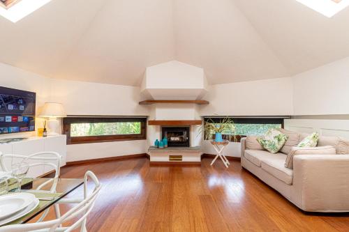 a living room with a couch and a table at Il camino felice - 201 by Houset in Monza