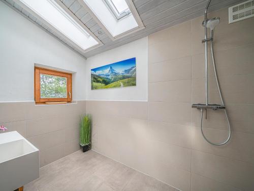 a bathroom with a shower and a sink at Tauernhaus Madelief in Piesendorf