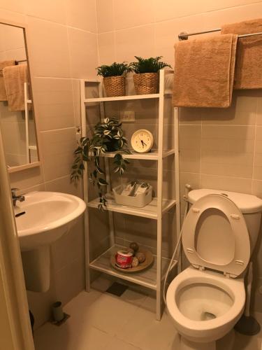 a bathroom with a toilet and a sink at Apartment in Rizal short stay only in Teresa