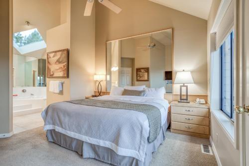 a bedroom with a bed and a large mirror at River Ridge 421AB - Meredith Lodging in Bend