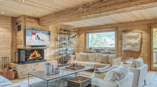 Телевизор и/или развлекательный центр в Chalet Alps Rosiere Courchevel