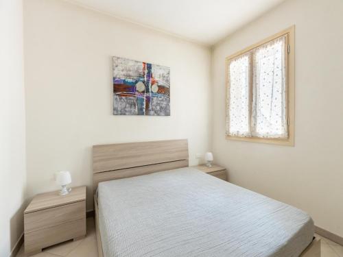 En eller flere senge i et værelse på Apaerment with terrace sea view in Castelsardo