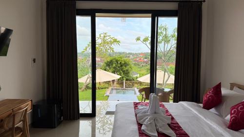 Postel nebo postele na pokoji v ubytování Umah 610