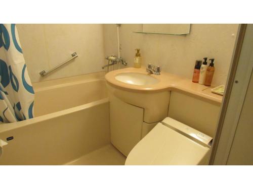 a bathroom with a sink and a toilet and a tub at Utsunomiya Inter Resort Hotel - Vacation STAY 68874v in Utsunomiya