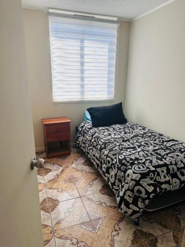 Postel nebo postele na pokoji v ubytování Departamento Playa Dichato