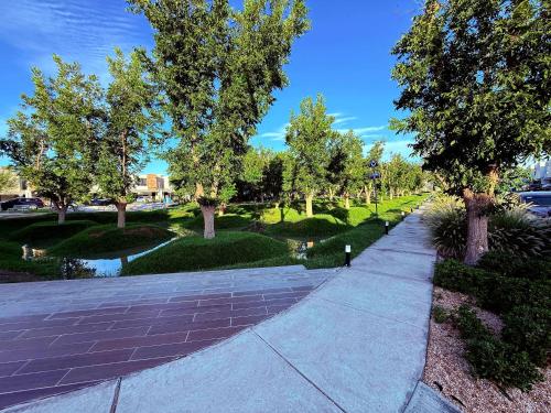 a walkway with trees on the side of a park at Casona Álamo in La Coyotera