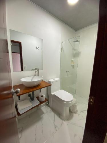a bathroom with a sink and a toilet and a shower at Rosablanca RN in Guaduas
