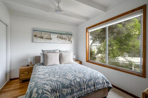 En eller flere senge i et værelse på Walk to Beach Pet friendly Sleep 5