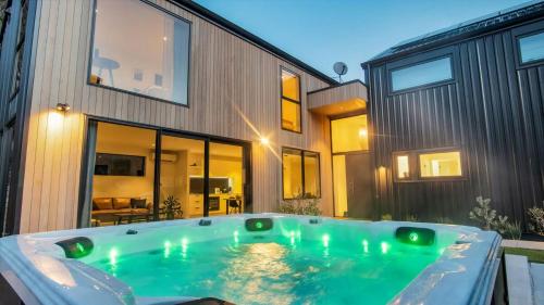 a hot tub in the backyard of a house at The Gold Mine in Arrowtown