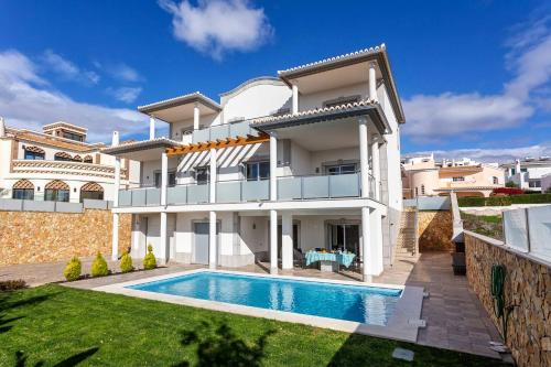 an image of a house with a swimming pool at Luxury Vau Beach Villa with Private Heated Pool in Portimão