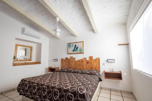 Postel nebo postele na pokoji v ubytování Mar y Cocos Hotel & Villas