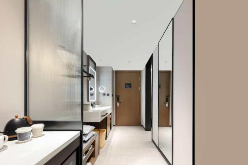 a kitchen with a hallway with a sink at Atour Hotel Shanghai Songjiang G60 Dongjing in Shanghai