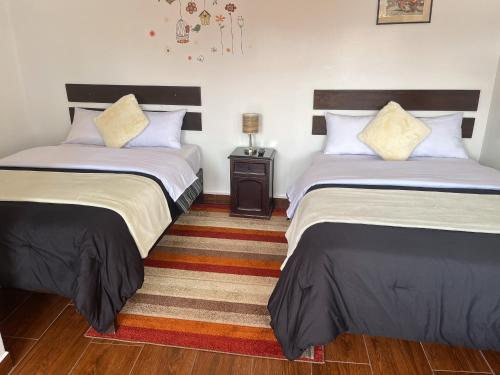 Postel nebo postele na pokoji v ubytování Cusco and Rock